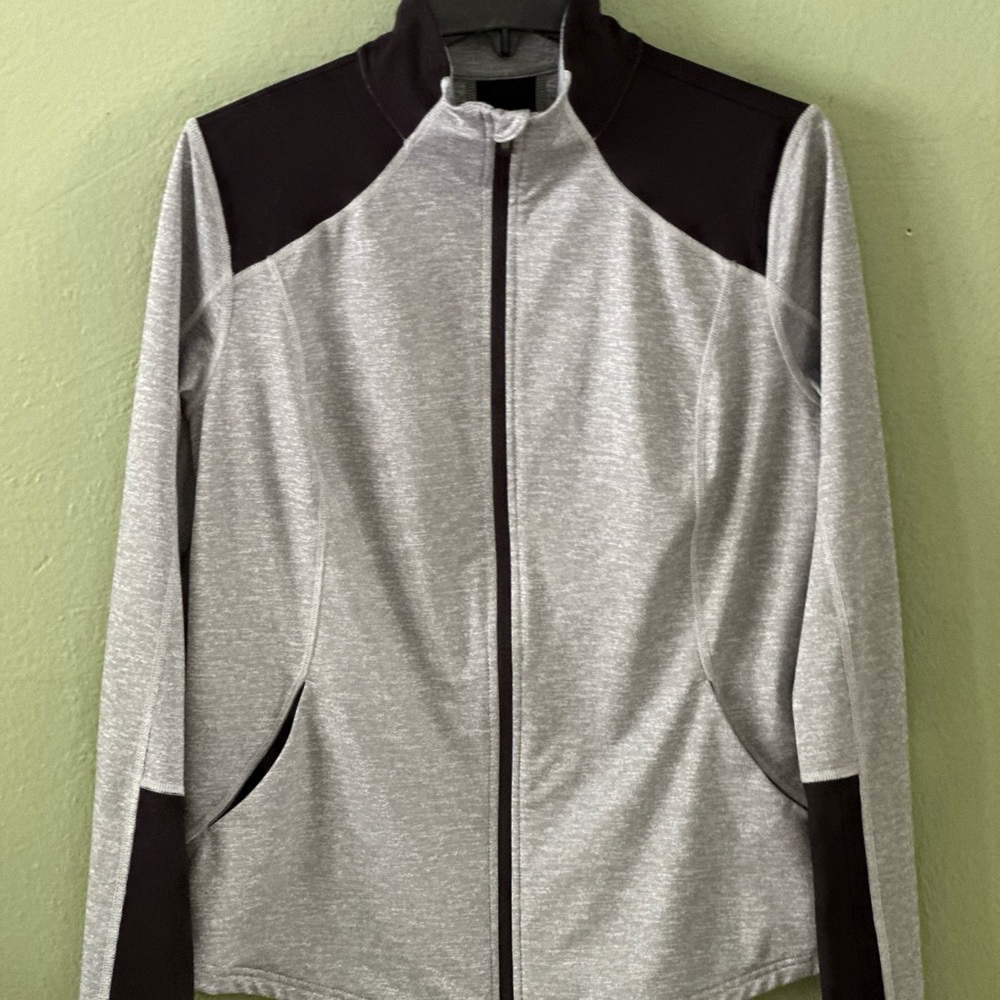 Stretchy jersey jacket; no labels or care instructions.